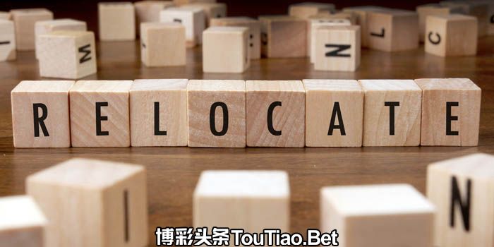 Wooden cubes spelling the word "relocate"
