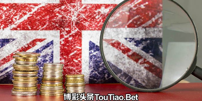 A magnifying glass in front of the British flag and a pile of coins